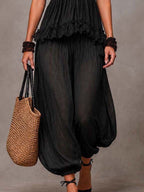 Top in pizzo scollo a V bohémien nero e pantaloni Harem coordinati