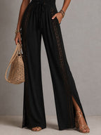Nina | Tuta Boho Nera in Pizzo con Scollo a V e Gambe Larghe