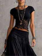 Completo top in pizzo nero trasparente e gonna lunga plissettata
