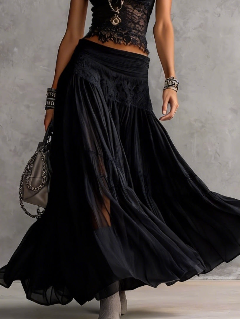 Completo top in pizzo nero trasparente e gonna lunga plissettata